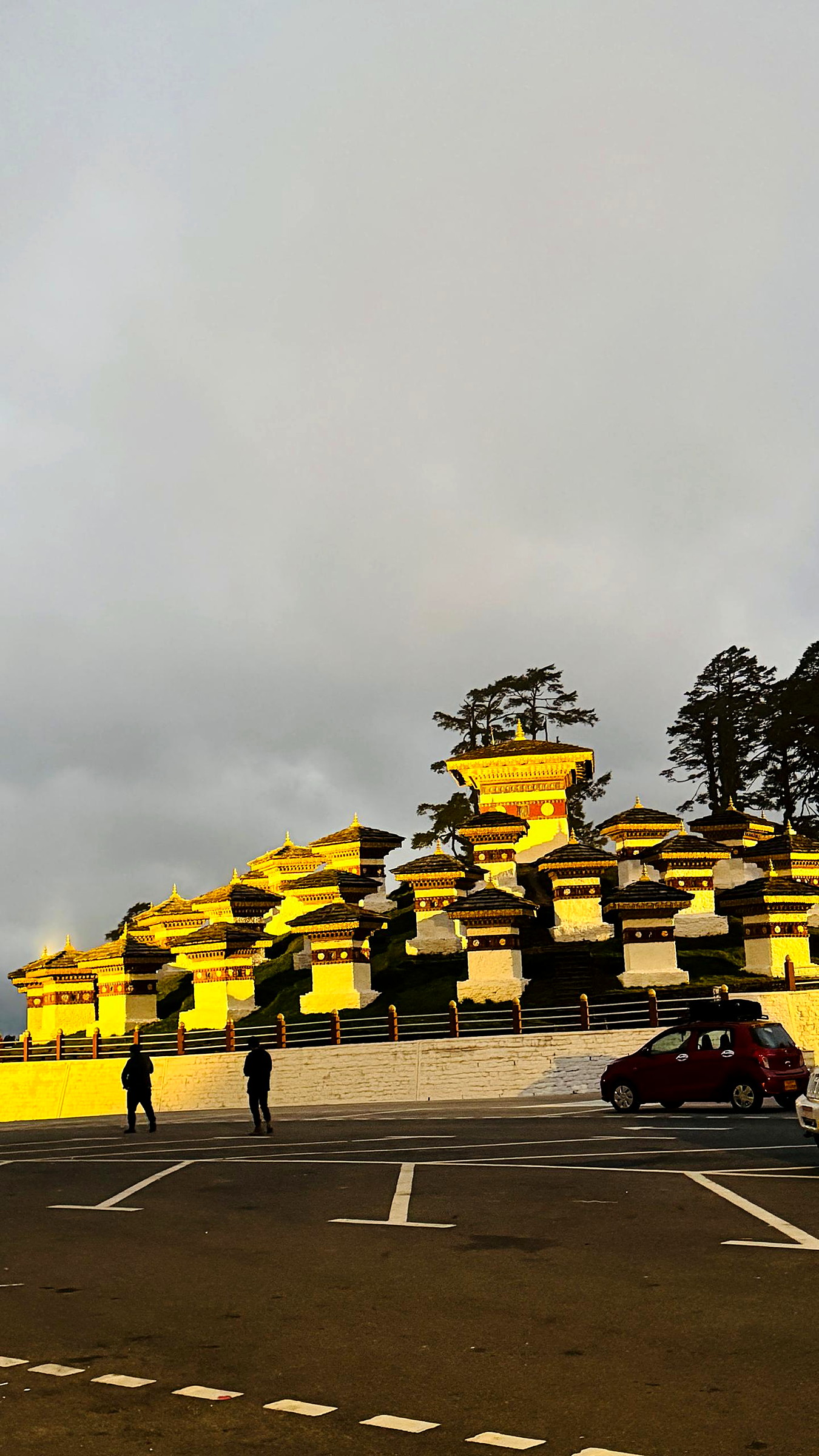 The 108 chortens of Dochula Pass with prayer flags in the mist