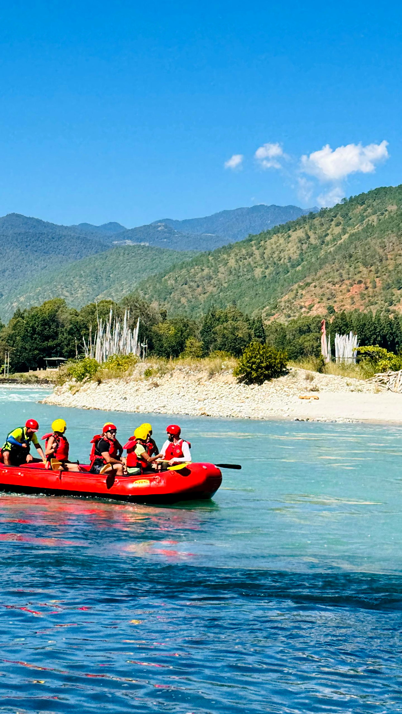 Rafters paddling through white water on the Mo Chhu river