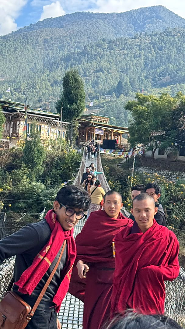A guest walking the Punakha suspension bridge